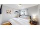 Bedroom with large bed, closet, and bright window at 1852 S Forest St, Denver, CO 80222