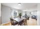Bright dining area with natural light, showcasing hardwood floors and an open layout to the living space at 1852 S Forest St, Denver, CO 80222