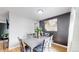Stylish dining area with a modern table and chairs, featuring a decorative accent wall at 1852 S Forest St, Denver, CO 80222