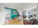 Bright living room featuring hardwood floors, stylish furnishings, and an open floor plan at 1852 S Forest St, Denver, CO 80222