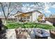 Expansive backyard with patio, hot tub, and lush lawn, perfect for outdoor entertaining at 10889 Alcott Ct, Denver, CO 80234