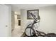 Basement hallway featuring a wine rack and workout equipment at 10889 Alcott Ct, Denver, CO 80234