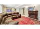 Comfortable basement Gathering room with an electric fireplace and wet bar at 10889 Alcott Ct, Denver, CO 80234