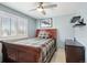 Cozy bedroom with natural light from shuttered windows and a wooden framed bed at 10889 Alcott Ct, Denver, CO 80234