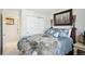 Inviting bedroom featuring a queen bed, soft lighting, and a closet at 10889 Alcott Ct, Denver, CO 80234