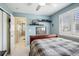 Inviting bedroom featuring a bed, closet, and blue painted walls at 10889 Alcott Ct, Denver, CO 80234