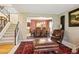 Open concept foyer featuring stairs leading upstairs and an open view of the dining room at 10889 Alcott Ct, Denver, CO 80234