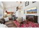 Bright living room with a vaulted ceiling, open-concept layout, and views of the dining area at 10889 Alcott Ct, Denver, CO 80234