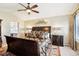 Spacious main bedroom featuring a ceiling fan, decorative art, and large bed at 10889 Alcott Ct, Denver, CO 80234