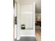 Welcoming entryway with coat hooks, modern decor, and seamless hardwood flooring at 654 S Shoshone St, Denver, CO 80223