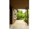 Charming covered front porch with decorative metalwork and a view of the landscaped yard at 654 S Shoshone St, Denver, CO 80223