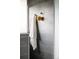 Modern shower with gray subway tile, a towel, and a sponge hanging on the wall at 654 S Shoshone St, Denver, CO 80223