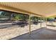 View from the covered back patio looking out to the landscaped yard, providing a relaxing outdoor space at 3256 S Nucla St, Aurora, CO 80013