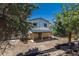 Backyard with a covered patio and partially xeriscaped yard; offers potential for customization and outdoor enjoyment at 3256 S Nucla St, Aurora, CO 80013