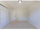 A bright bedroom features carpet, a closet and multiple doors at 3256 S Nucla St, Aurora, CO 80013