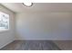 Dining area featuring gray wood flooring, white walls and trim, and a bright window at 3256 S Nucla St, Aurora, CO 80013