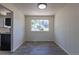 Bright dining room features gray wood flooring and natural light from a large window at 3256 S Nucla St, Aurora, CO 80013