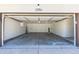 Spacious and clean two-car garage with ample room for vehicles and storage, and is well lit with an electric door at 3256 S Nucla St, Aurora, CO 80013
