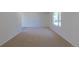 Spacious living room featuring neutral carpet and white walls offering a blank canvas for personal design at 3256 S Nucla St, Aurora, CO 80013