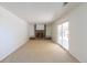 Spacious living room features a brick fireplace with built-in shelving and sliding glass door at 3256 S Nucla St, Aurora, CO 80013