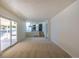 Bright and open living room features sliding door to the backyard and steps to the kitchen at 3256 S Nucla St, Aurora, CO 80013