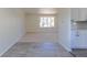 Bright, open living room with neutral carpet, white walls, and a large window with natural light at 3256 S Nucla St, Aurora, CO 80013