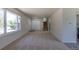 Open living room with a large window, front door entrance, and staircase to the upper level at 3256 S Nucla St, Aurora, CO 80013