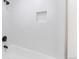A bright shower with white subway tile and a built-in niche at 3256 S Nucla St, Aurora, CO 80013