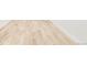 Image of light wood floors and white base trim with a white wall on the right side at 3100 S Holly Pl, Denver, CO 80222