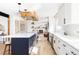 Beautiful kitchen featuring a large island, modern appliances, stone countertops and an open floorplan at 3100 S Holly Pl, Denver, CO 80222