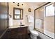 Well-appointed bathroom featuring a walk-in shower and granite countertop at 8294 Wild Timber Dr, Franktown, CO 80116