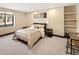 Cozy carpeted bedroom features a window, natural light, and a workspace at 8294 Wild Timber Dr, Franktown, CO 80116