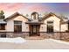 Charming front exterior with stone accents, dormer window, and a well-manicured entrance at 8294 Wild Timber Dr, Franktown, CO 80116