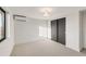 Neutral bedroom featuring carpet, modern light fixture and black closet doors at 4487 Utica St, Denver, CO 80211