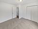 Cozy bedroom featuring soft carpeting and a convenient closet, ensuring a comfortable and organized space at 1045 Mobile St, Aurora, CO 80011
