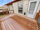 Wooden deck with railings, access to the house and a dog door at 1045 Mobile St, Aurora, CO 80011
