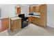 Well-equipped kitchen with modern appliances and abundant cabinetry, designed for culinary enthusiasts and functionality at 1045 Mobile St, Aurora, CO 80011