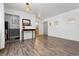 Living room with hardwood floors and view into kitchen and hallway at 855 N Pennsylvania St # 407, Denver, CO 80203