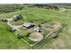 Overhead view shows the home, horse property, fencing, and paddocks at 595 W Oak Hill Ln, Castle Rock, CO 80108