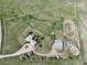 An aerial view of the horse property shows the layout of buildings and training areas at 595 W Oak Hill Ln, Castle Rock, CO 80108