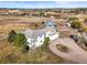 Expansive aerial view of estate, showcasing the home's architecture, surroundings, and privacy at 595 W Oak Hill Ln, Castle Rock, CO 80108