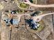 Overhead view of a large home, outbuildings, and horse area enclosed by white fencing at 595 W Oak Hill Ln, Castle Rock, CO 80108