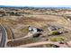 Aerial view of a sprawling ranch-style estate highlighting the extensive land and multiple buildings at 595 W Oak Hill Ln, Castle Rock, CO 80108