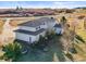 Aerial view of a large house showcasing the architecture and a well-maintained landscaped yard at 595 W Oak Hill Ln, Castle Rock, CO 80108