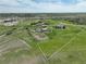 Captured from above, the equestrian property boasts loafing sheds, riding areas, and wide open space at 595 W Oak Hill Ln, Castle Rock, CO 80108