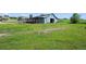 Picturesque view of the well-kept barn nestled in a vast green field under a clear blue sky at 595 W Oak Hill Ln, Castle Rock, CO 80108