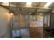 Inside of the barn reveals stalls with sturdy wooden walls and metal gates, ensuring safe and comfortable housing for animals at 595 W Oak Hill Ln, Castle Rock, CO 80108