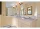 Bathroom featuring double sinks, soft lighting, and ample counter space at 595 W Oak Hill Ln, Castle Rock, CO 80108