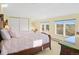 Bright bedroom featuring two beds, natural light, and ample closet space at 595 W Oak Hill Ln, Castle Rock, CO 80108