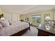 Bright bedroom featuring two beds and a large window with picturesque views of the surrounding landscape at 595 W Oak Hill Ln, Castle Rock, CO 80108